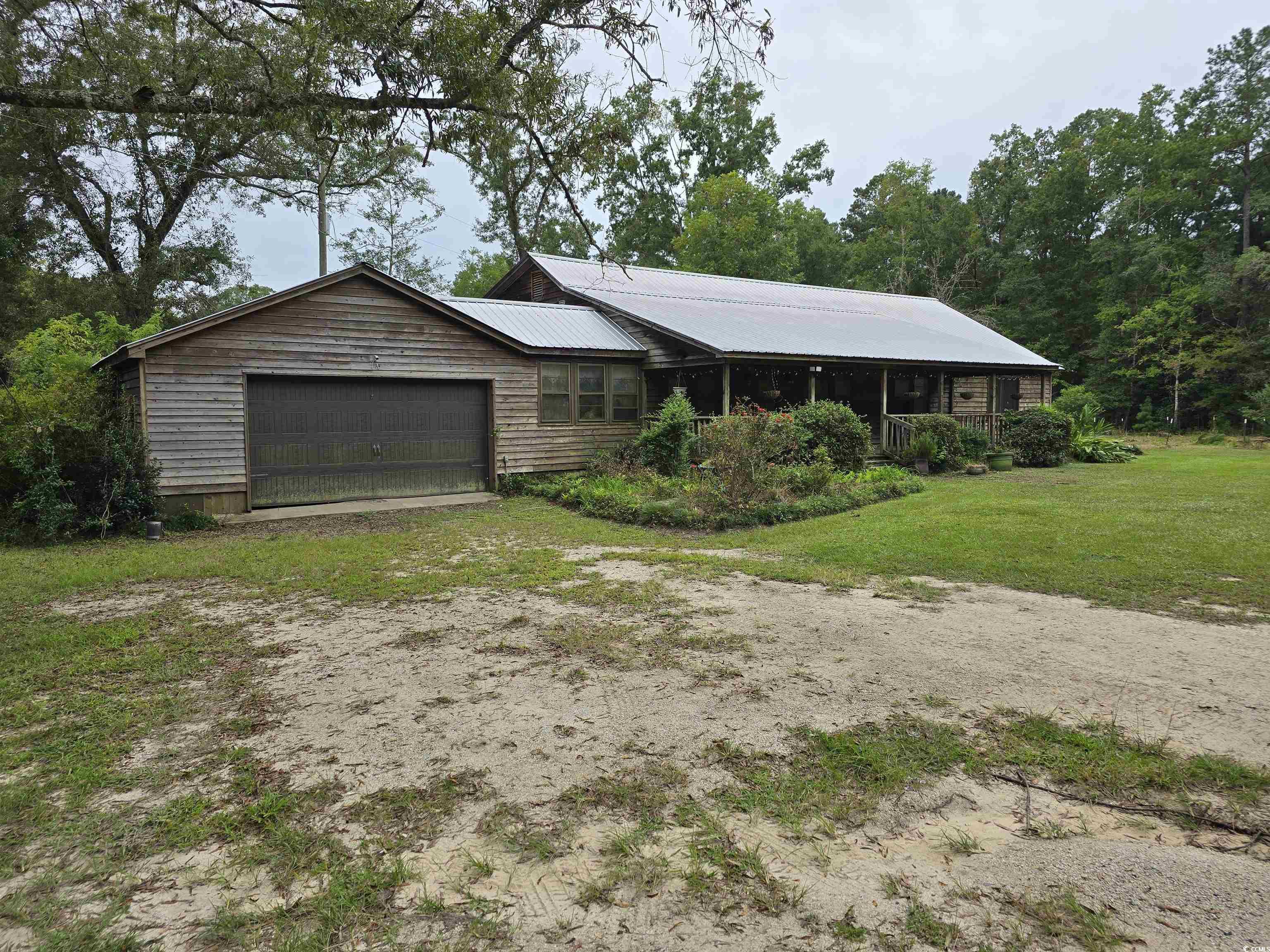 73 Porter Road Georgetown, SC 29440 - Photo 3 of 24 Ranch-style house with a garage and a front lawn