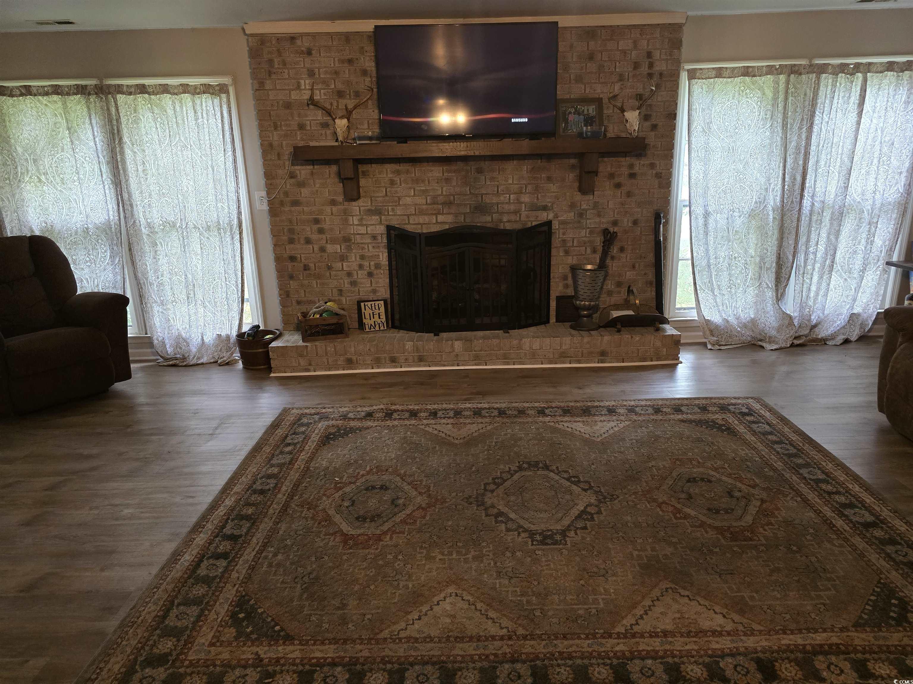 73 Porter Road Georgetown, SC 29440 - Photo 7 of 24 Living room with gas logs fireplace