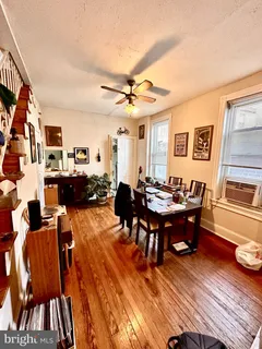 a living room with furniture a rug and a chandelier