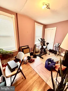 a room with lots of chairs and mirrors