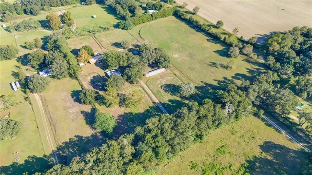 a view of a swimming pool with a yard