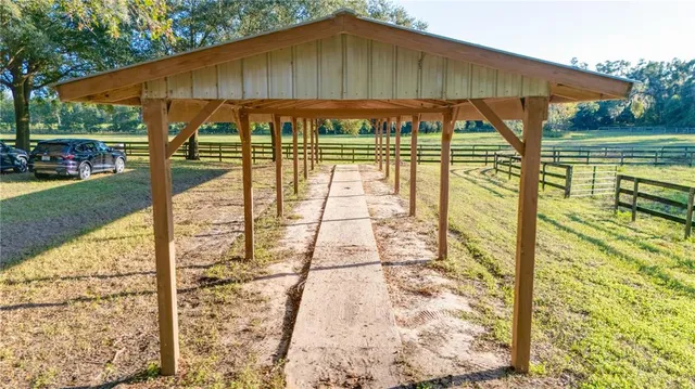 a view of a wooden deck and a yard
