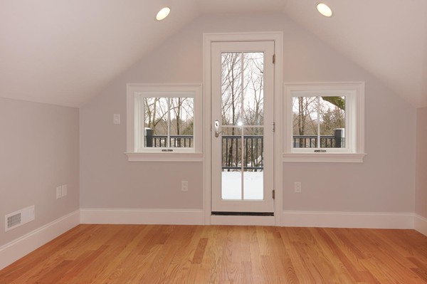 180 Pine Ridge Road Newton, MA 02468 - Photo 23 of 30 an empty room with wooden floor and windows