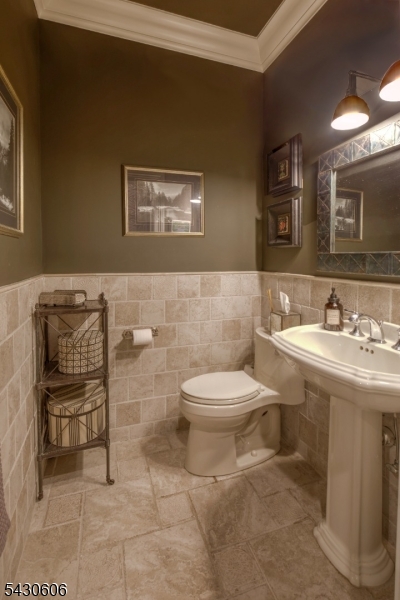 5 Burnett Road Mendham, NJ 07945 - Photo 44 of 50 a bathroom with a toilet a sink and mirror