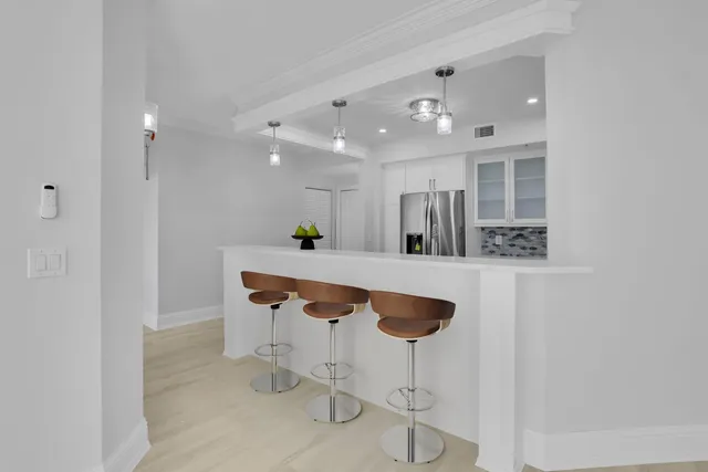 a kitchen with stainless steel appliances kitchen island granite countertop a cabinets and a sink