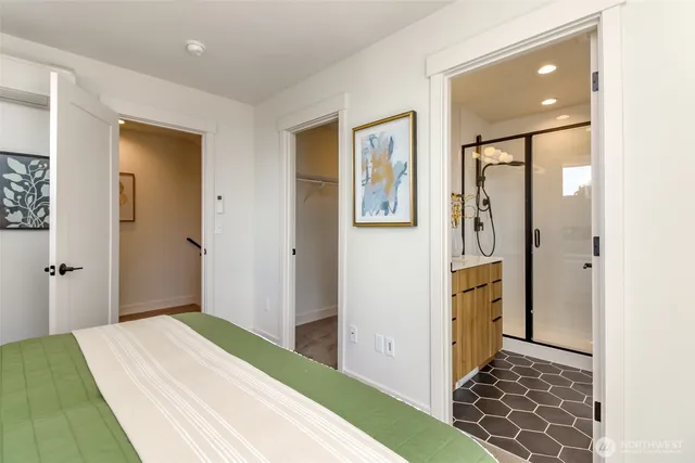 a view of a bathroom with sink and shower
