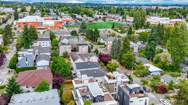 an aerial view of residential houses with outdoor space