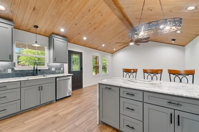 a kitchen with granite countertop lots of counter top space