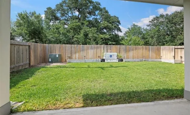 a view of backyard with small cabin