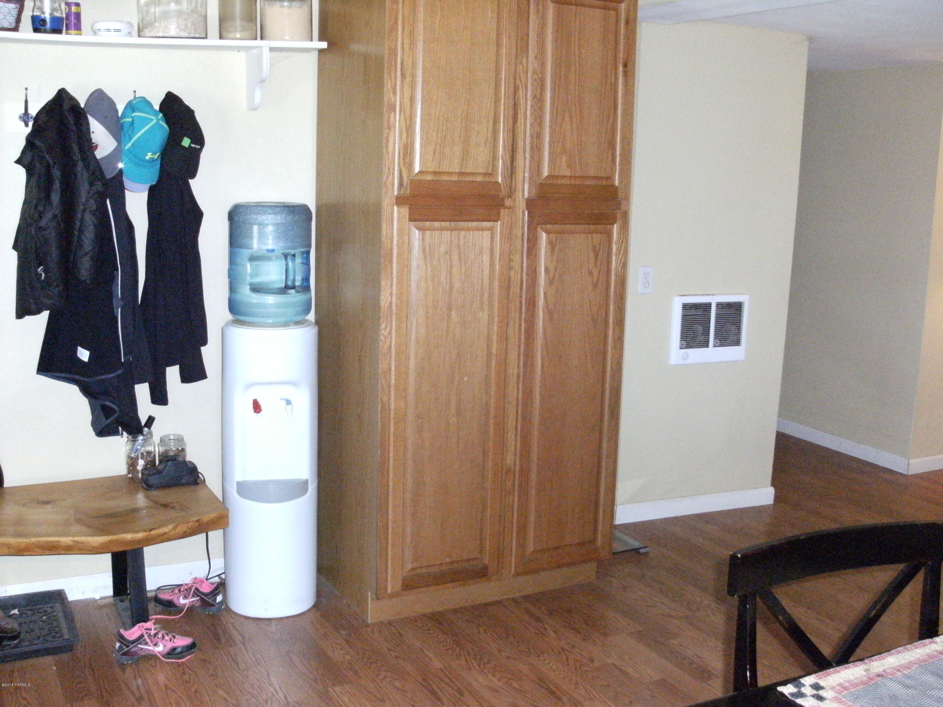 1180 Woodworth Road Grandview, WA 98930 - Photo 16 of 26 a view of walk in closet with clothes and shoes