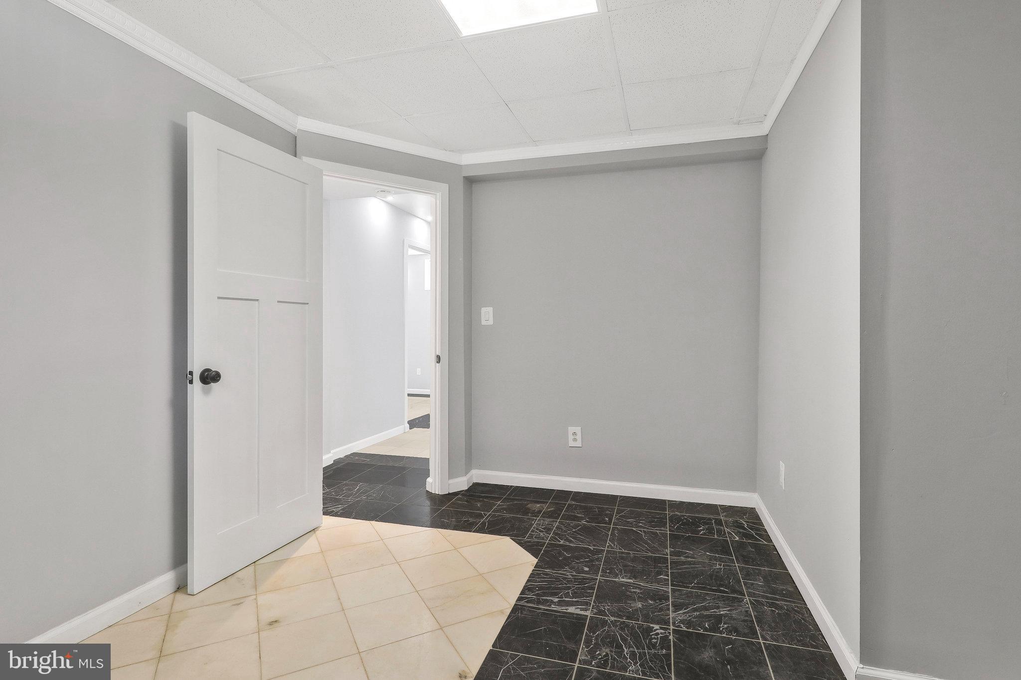 9600 Woodland Avenue Lanham, MD 20706 - Photo 32 of 41 a bathroom with a sink and a shower