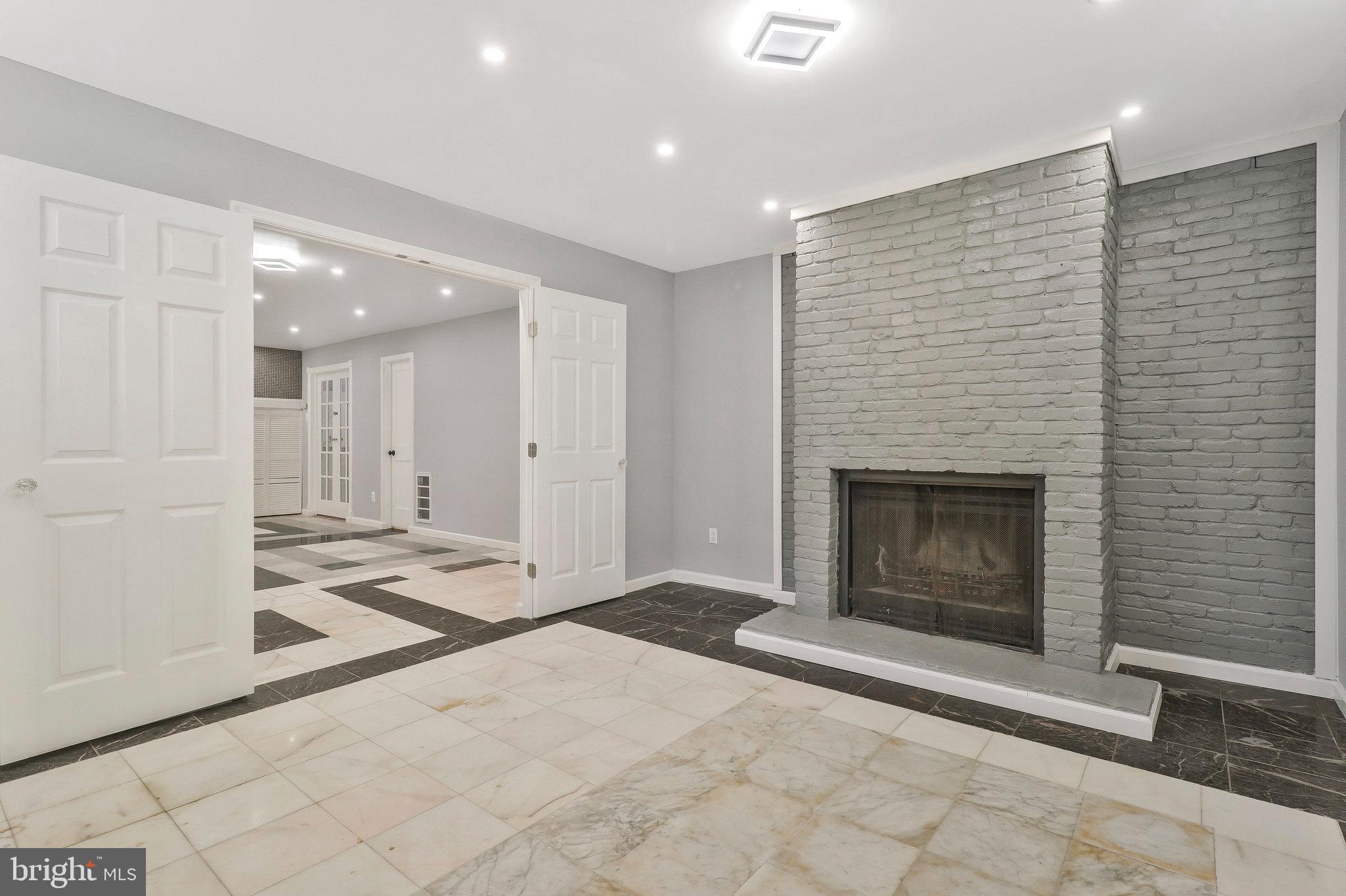 9600 Woodland Avenue Lanham, MD 20706 - Photo 38 of 41 a view of a livingroom with a fireplace