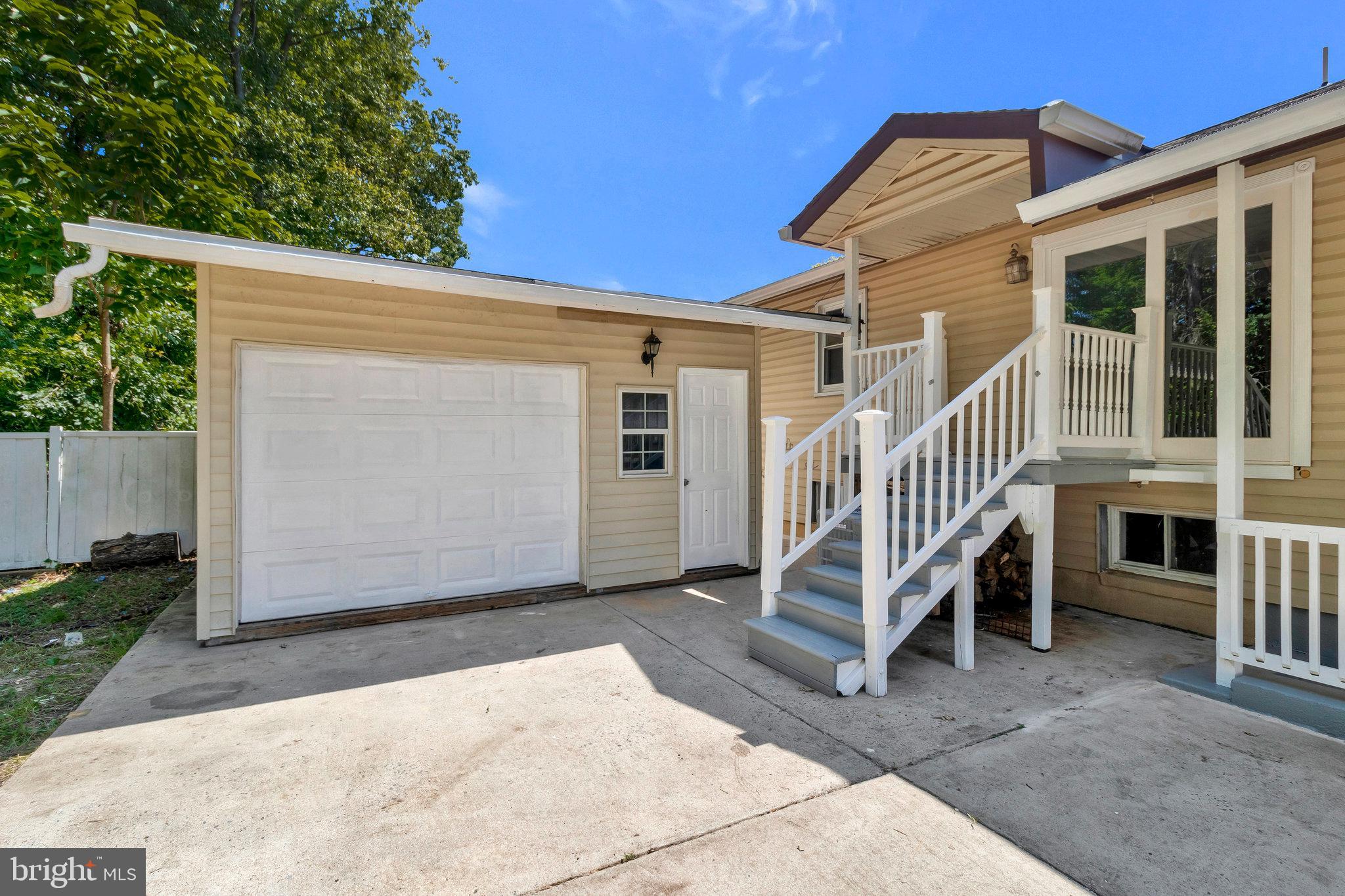 9600 Woodland Avenue Lanham, MD 20706 - Photo 41 of 41 a view of a house with a yard