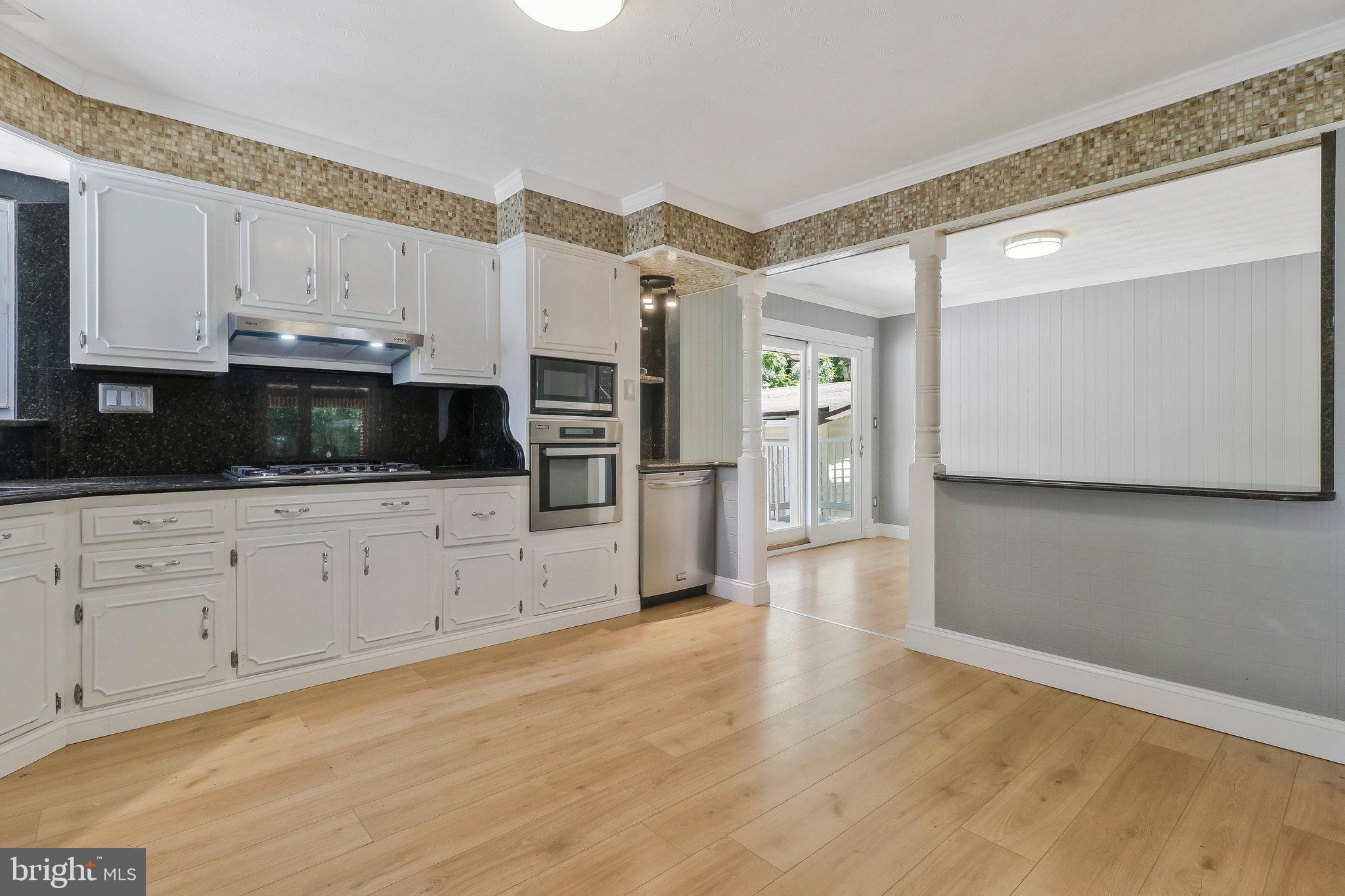 9600 Woodland Avenue Lanham, MD 20706 - Photo 10 of 41 a view of a kitchen with electric appliances