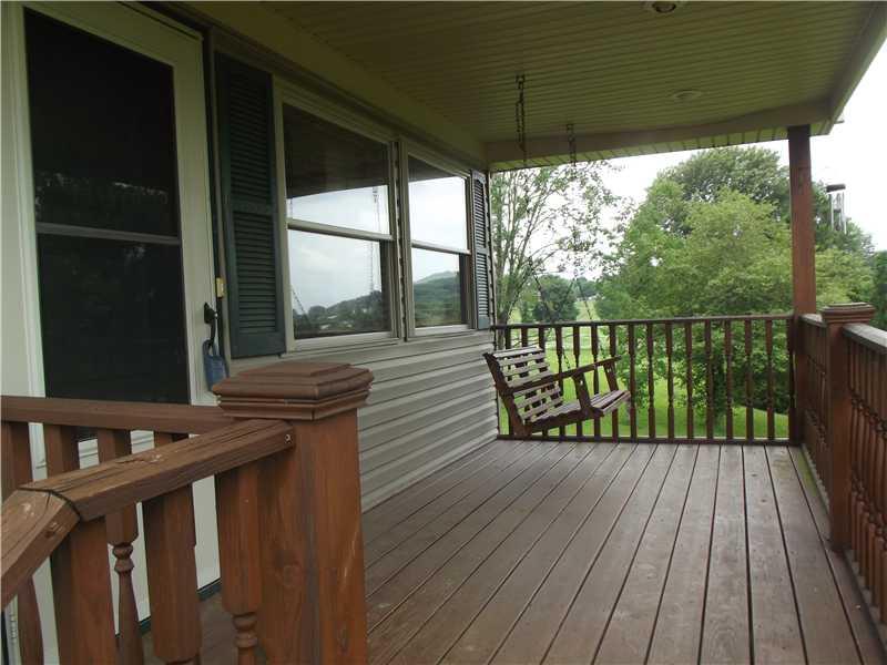 208 Pflugh Road Butler, PA 16001 - Photo 4 of 19 Patio/Deck. Covered front porch with a view.