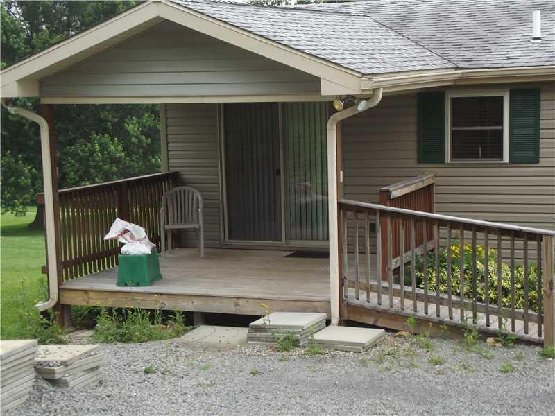 208 Pflugh Road Butler, PA 16001 - Photo 6 of 19 Patio/Deck. Covered rear deck with ramp from upper driveway.