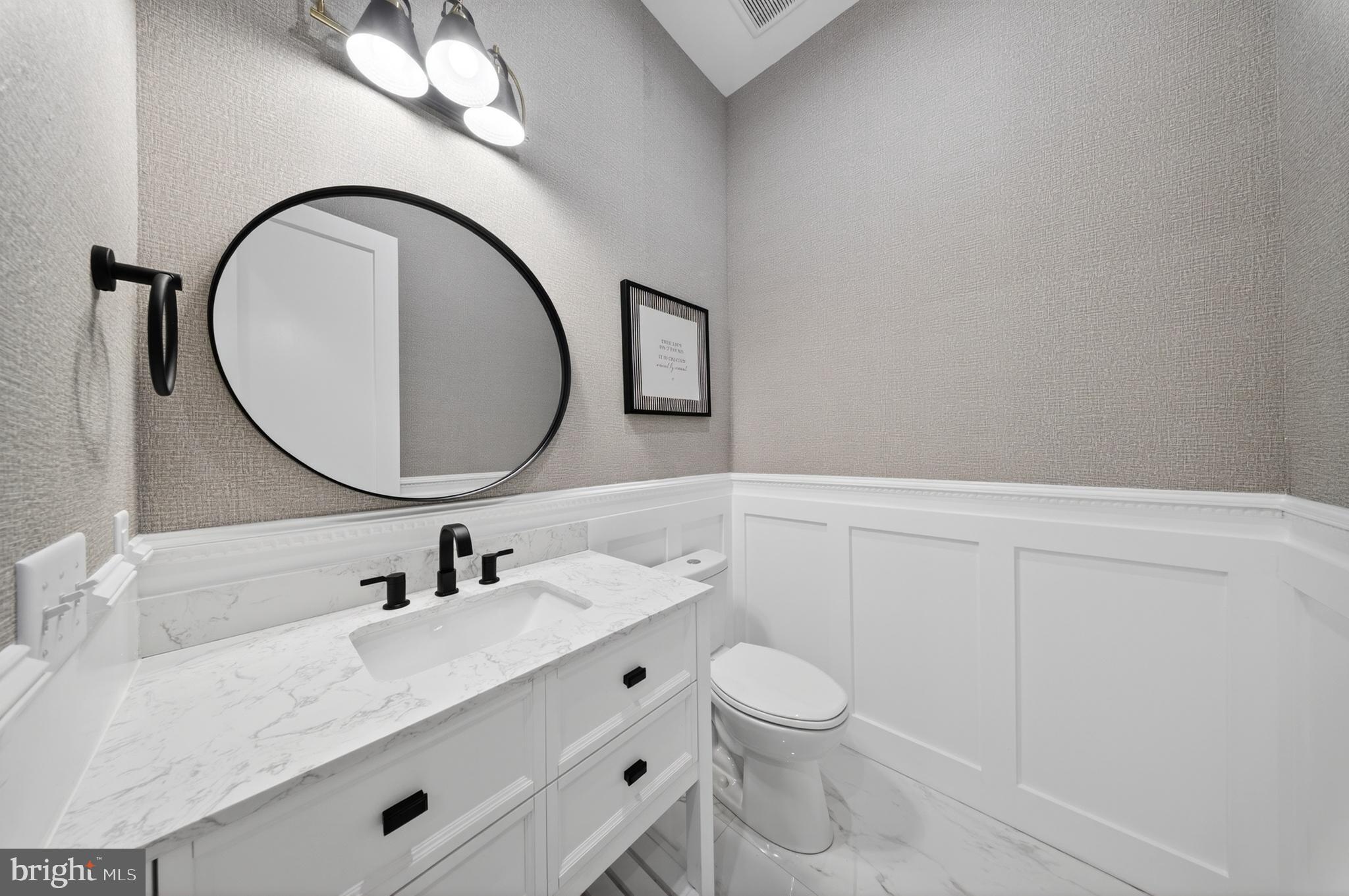 14133 Pepperbox Road Delmar, DE 19940 - Photo 25 of 59 a bathroom with a sink vanity granite and a mirror