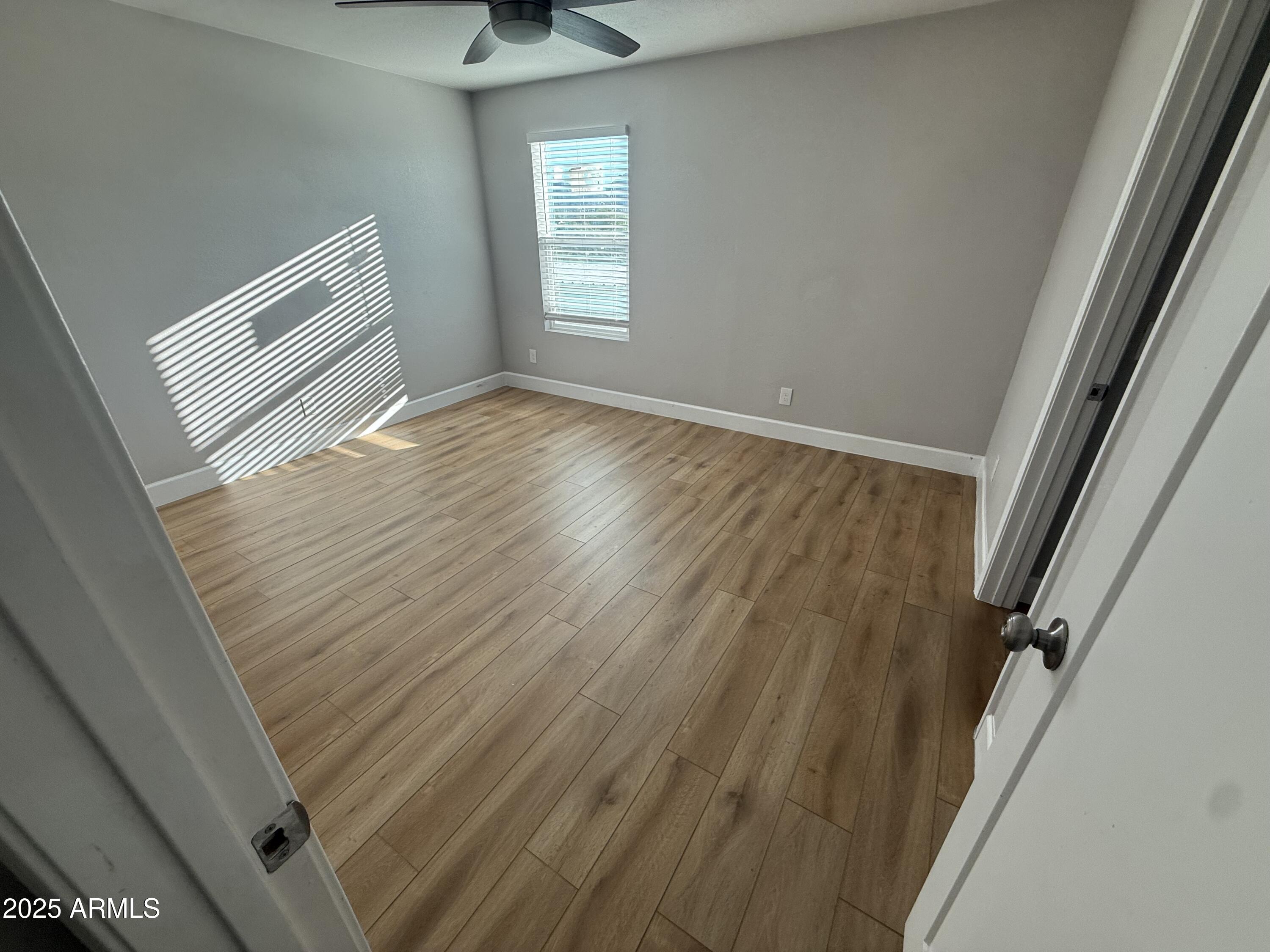 8801 North 8th Street, Unit 203 Phoenix, AZ 85020 - Photo 19 of 29 a view of a room with wooden floor and staircase