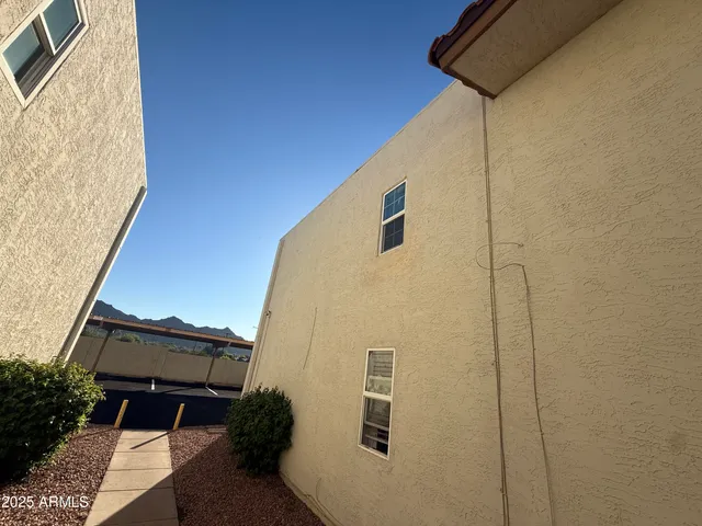 a back view of a house with a backyard