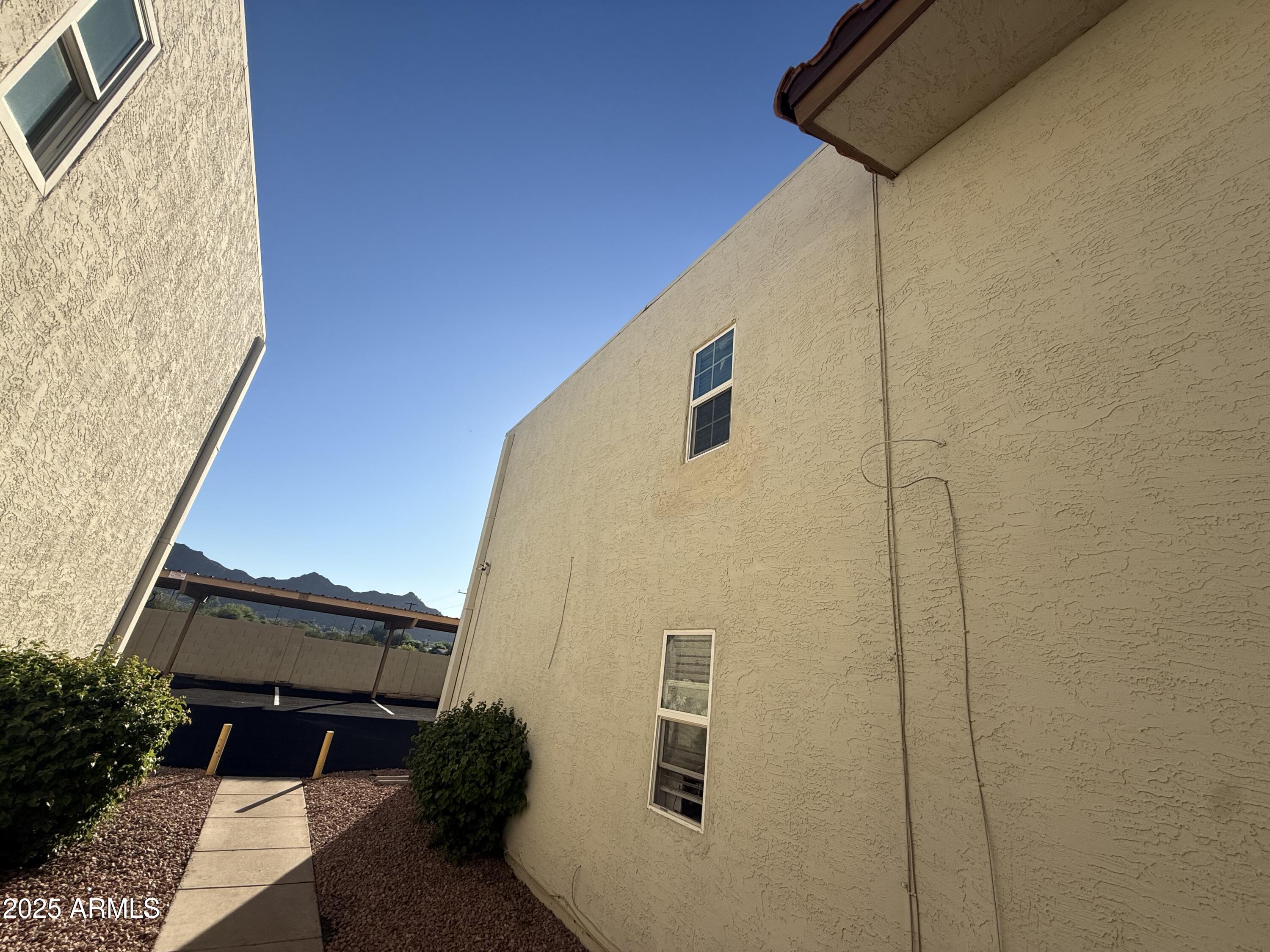 8801 North 8th Street, Unit 203 Phoenix, AZ 85020 - Photo 2 of 29 a back view of a house with a backyard