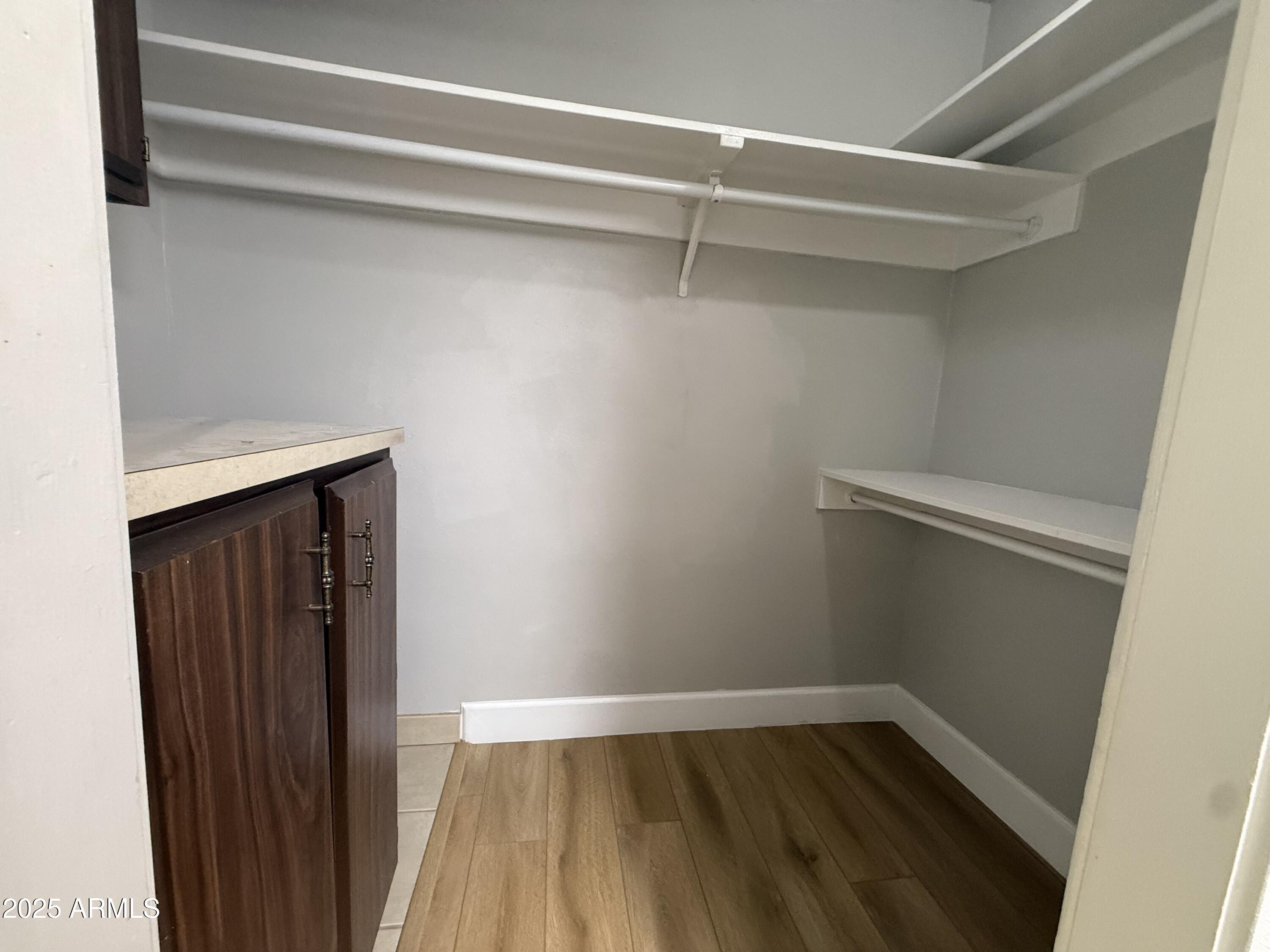 8801 North 8th Street, Unit 203 Phoenix, AZ 85020 - Photo 23 of 29 a view of an empty walk in closet