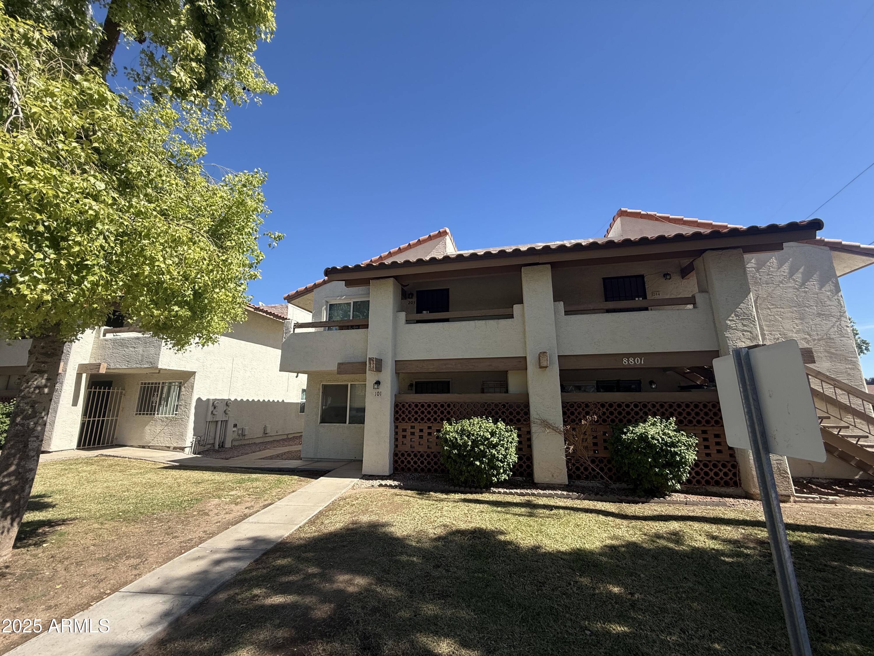 8801 North 8th Street, Unit 203 Phoenix, AZ 85020 - Photo 28 of 29 front view of a house with a yard