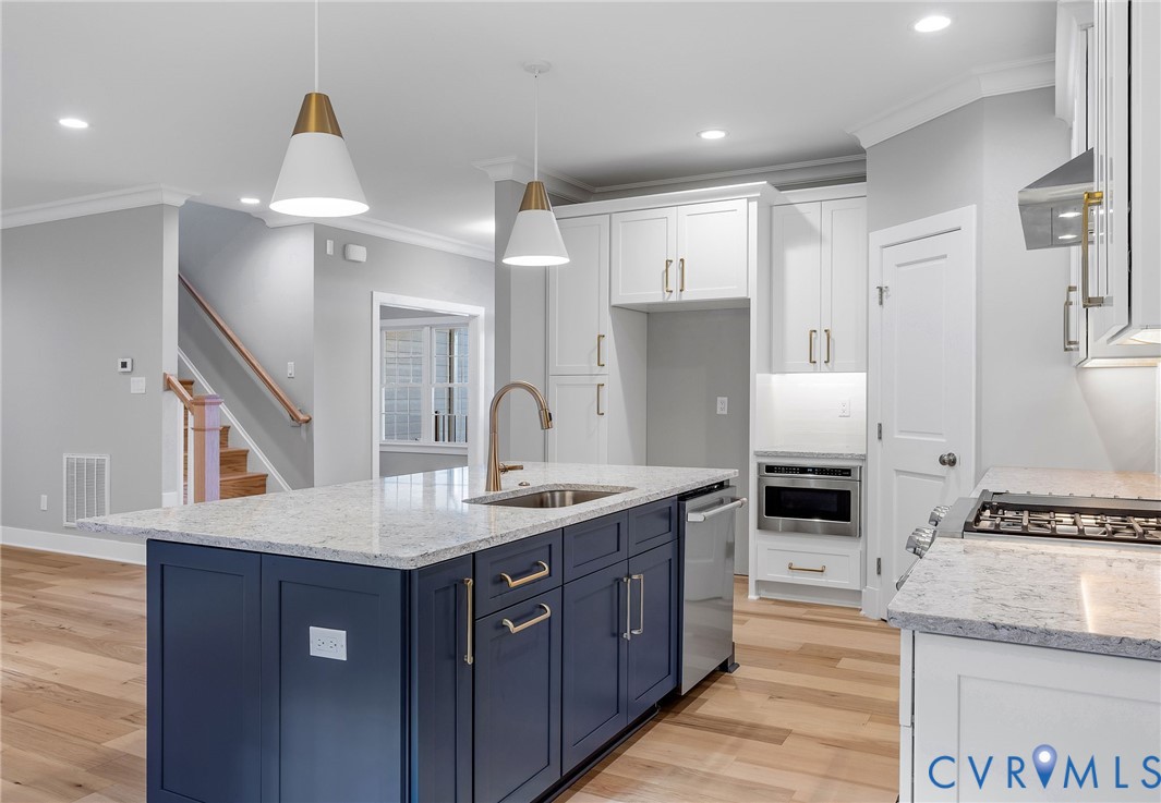 3107 Handley Road Midlothian, VA 23113 - Photo 14 of 50 a kitchen with stainless steel appliances granite countertop a sink stove and refrigerator