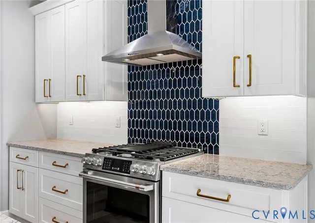 a kitchen with a stove and cabinets