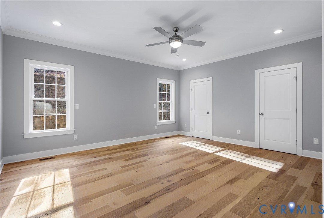 3107 Handley Road Midlothian, VA 23113 - Photo 25 of 50 a view of an empty room with wooden floor and a window