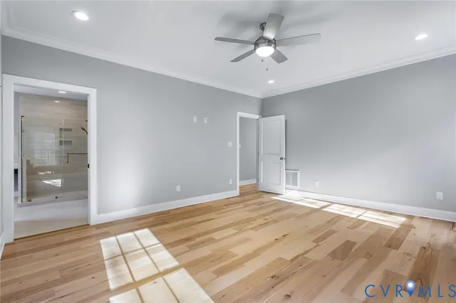 a view of an empty room with glass door