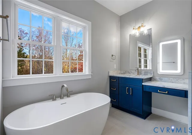 a bathroom with a bathtub and a sink