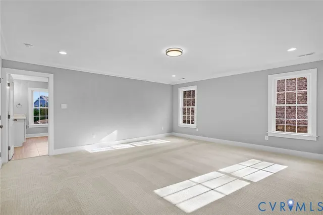 a bathroom with a granite countertop sink a large mirror and a window