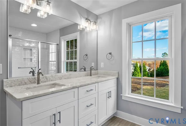 a bathroom with a sink and a shower