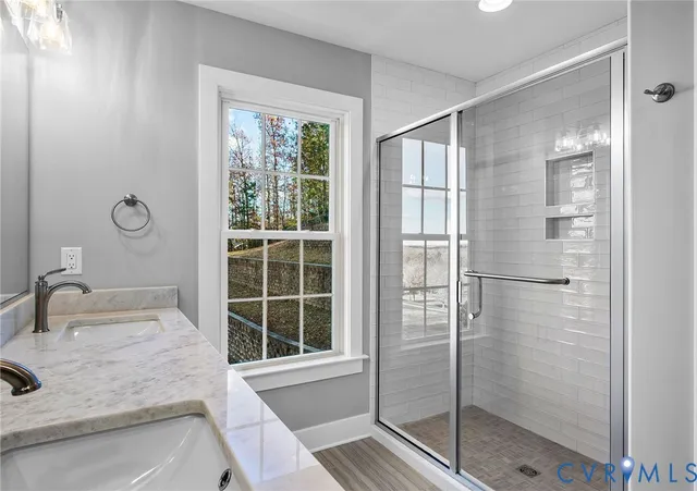 a bathroom with a glass shower door