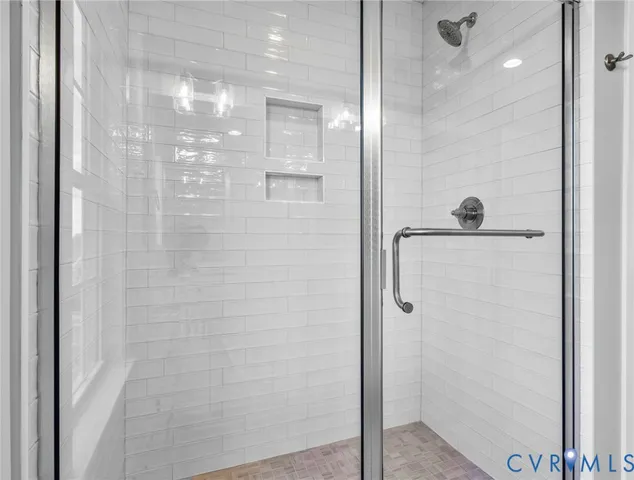 a bathroom with a shower and a window in it