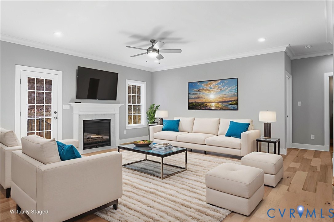 3107 Handley Road Midlothian, VA 23113 - Photo 8 of 50 a living room with furniture a fireplace and a flat screen tv