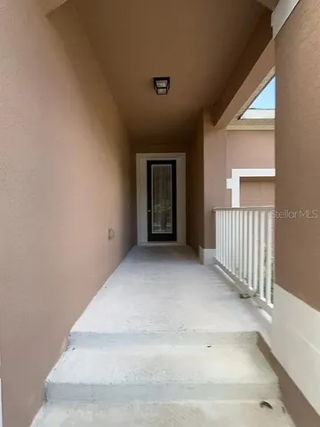 a view of an entryway with wooden floor
