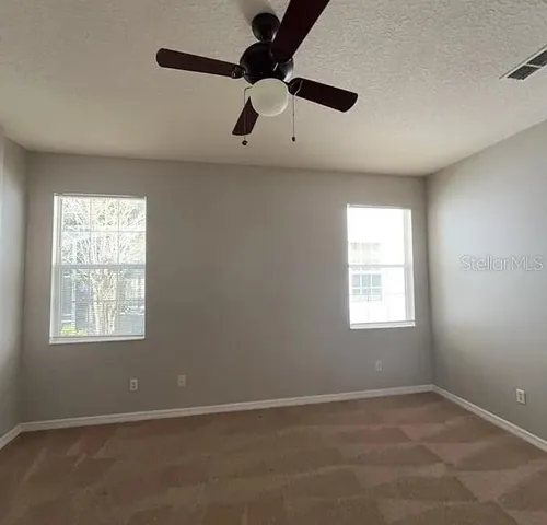 a view of an empty room with a window