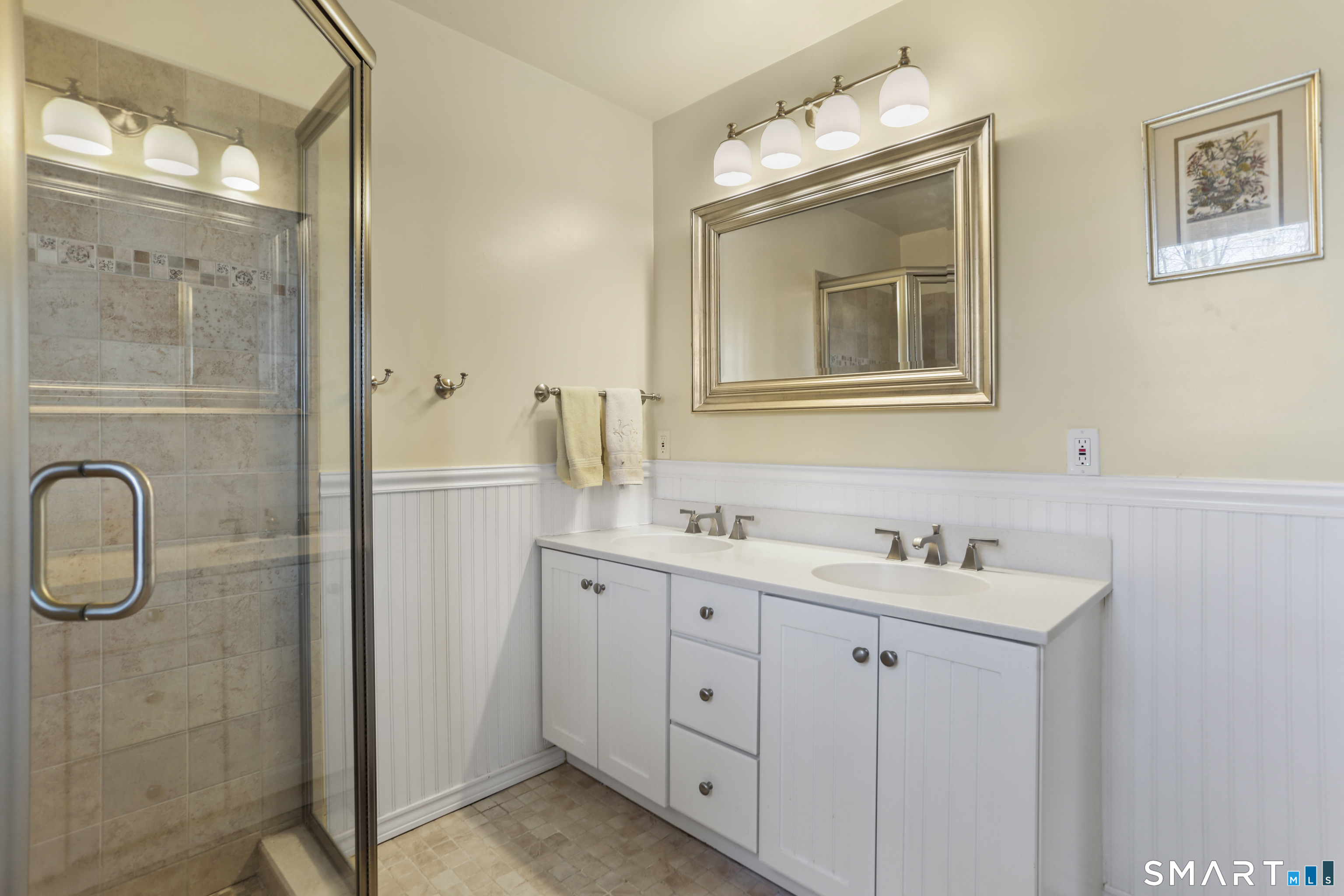 268 Umpawaug Road Redding, CT 06896 - Photo 13 of 28 a bathroom with a double vanity sink a mirror and a
