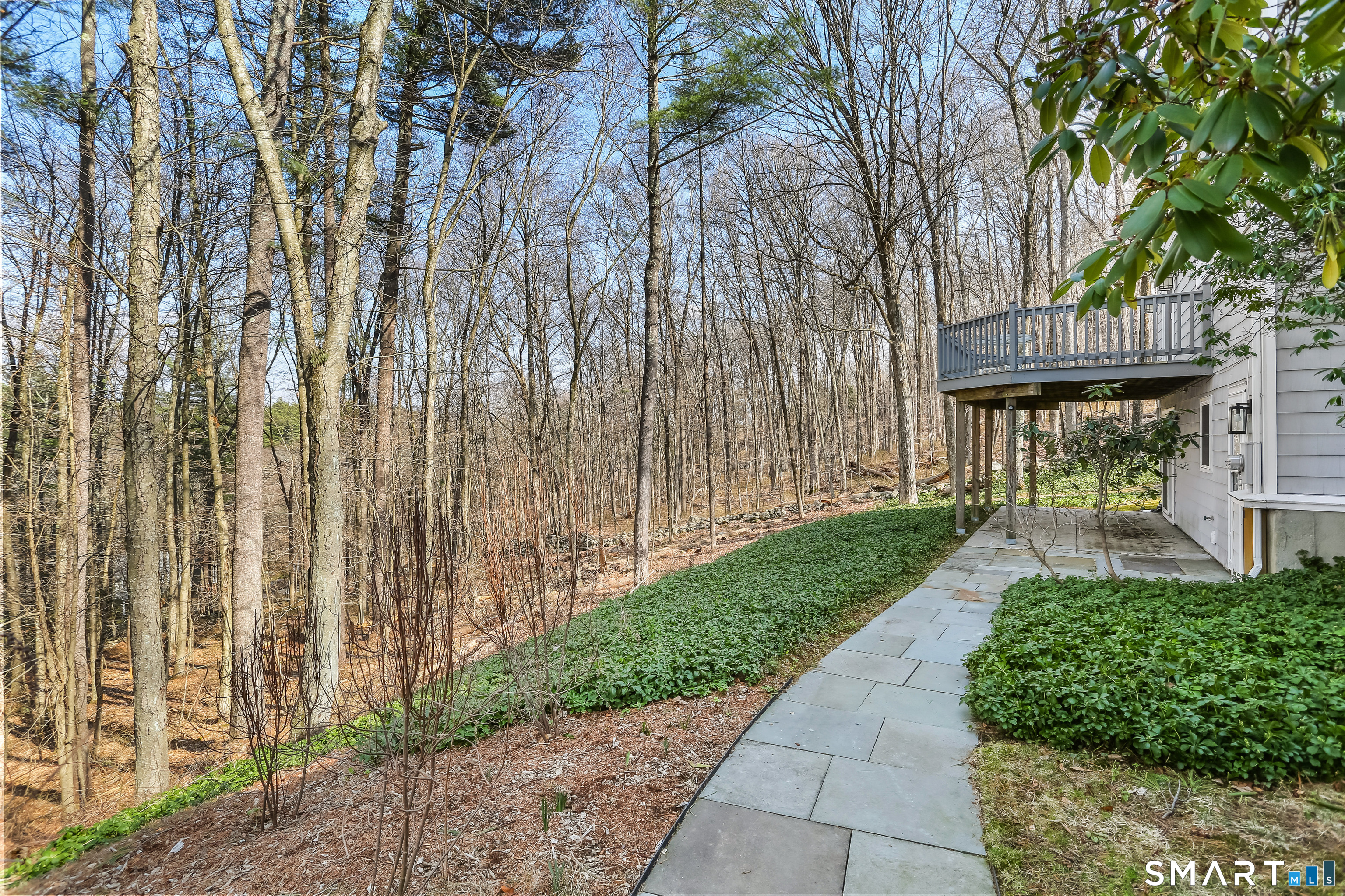 268 Umpawaug Road Redding, CT 06896 - Photo 24 of 28 a front view of a house with a garden