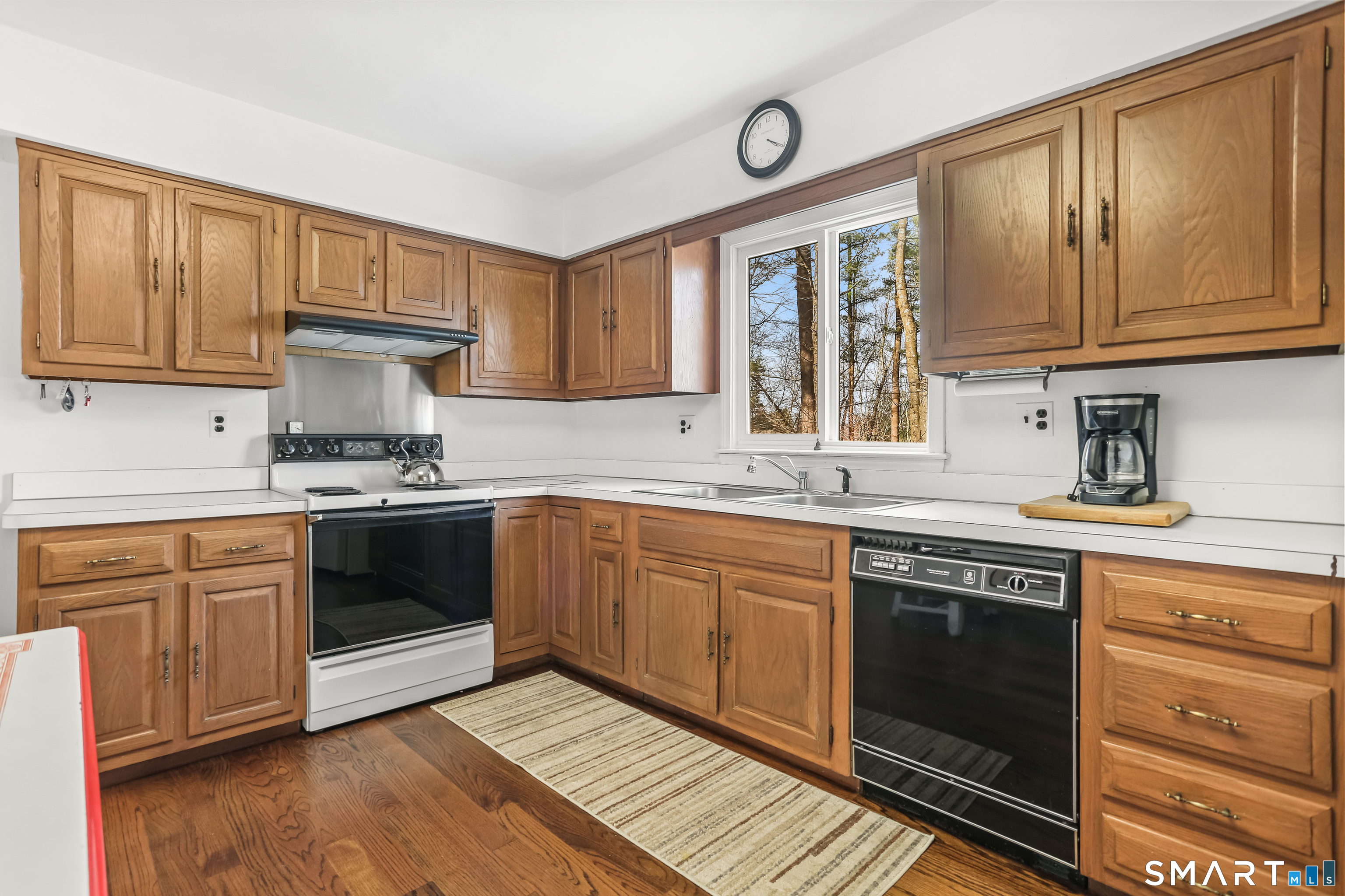 268 Umpawaug Road Redding, CT 06896 - Photo 8 of 28 a kitchen with stainless steel appliances granite countertop a stove sink and cabinets