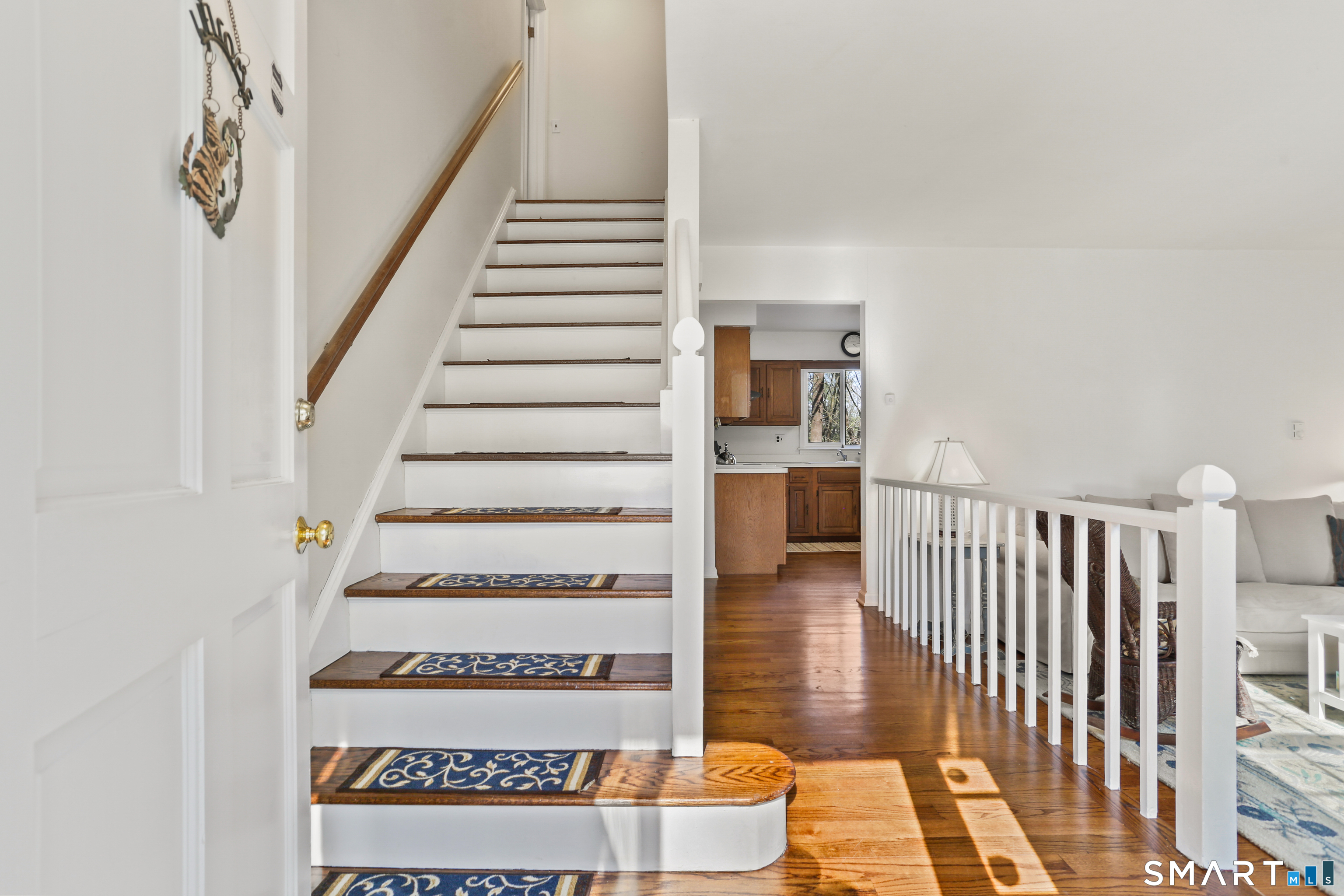 268 Umpawaug Road Redding, CT 06896 - Photo 10 of 28 a view of entryway and hall with wooden floor