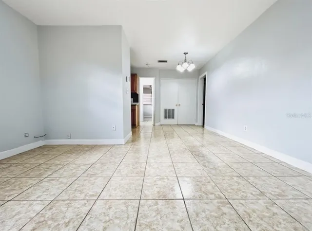 a view of an empty room with a window