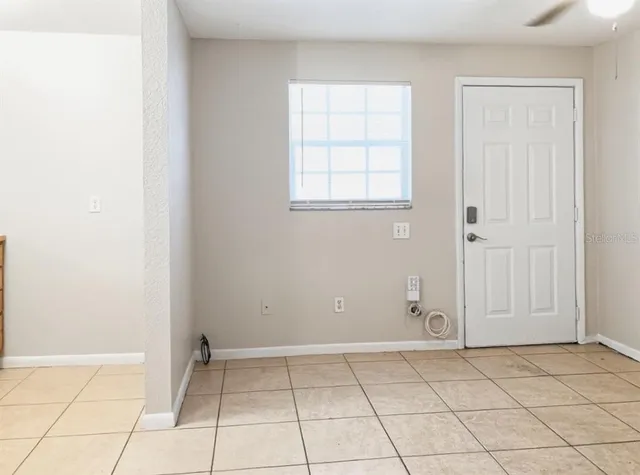 a view of an empty room with windows