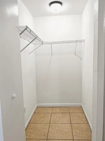 a kitchen with stainless steel appliances granite countertop a refrigerator oven a stove top oven and a sink