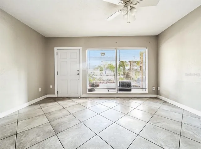a kitchen with granite countertop white cabinets and appliances
