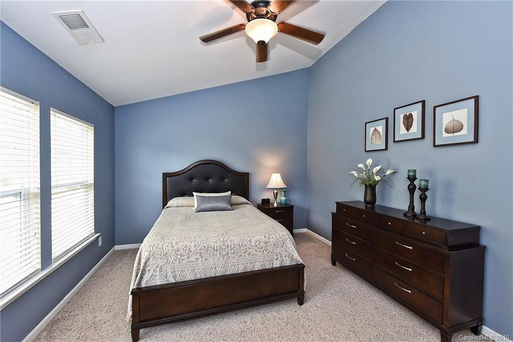 142 Whitley Mills Road Fort Mill, SC 29708 - Photo 11 of 24 a bedroom with a bed window and dresser