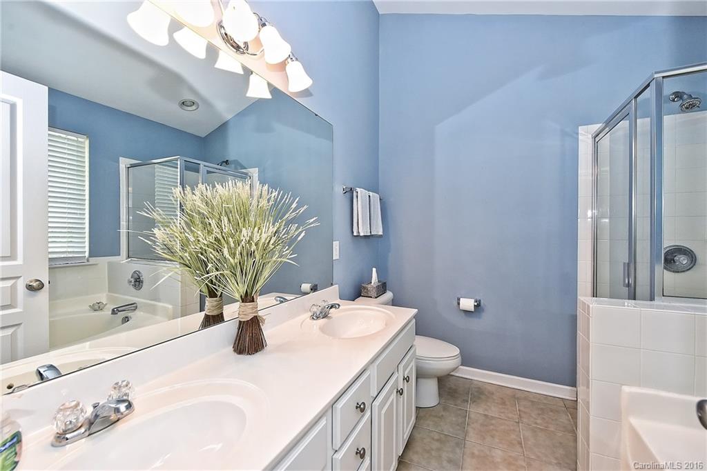 142 Whitley Mills Road Fort Mill, SC 29708 - Photo 13 of 24 a bathroom with a sink a toilet and shower