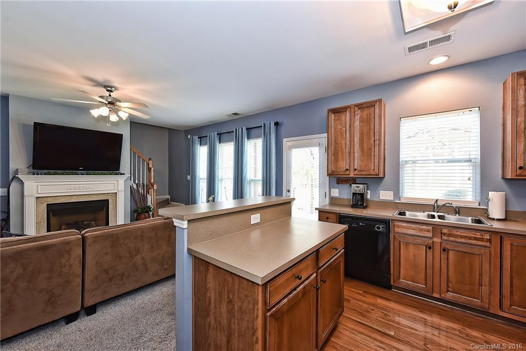 142 Whitley Mills Road Fort Mill, SC 29708 - Photo 9 of 24 a kitchen with a stove a sink and a refrigerator