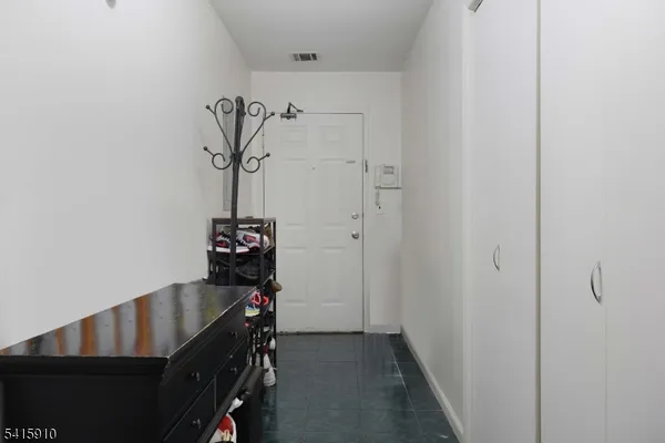 a bathroom with a glass shower door and a mirror